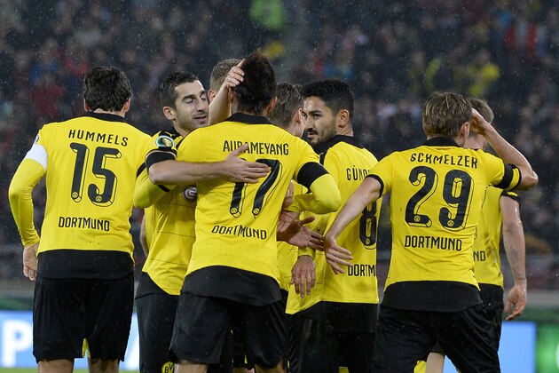 Dortmund's players celebrate after they scored the opening goal during the German Cup ( Pokal ) quarter final football match VfB Stuttgart v Borussia Dortmund on February 9, 2016 in Stuttgart. / AFP / Thomas Kienzle / RESTRICTIONS: ACCORDING TO DFB RULES IMAGE SEQUENCES TO SIMULATE VIDEO IS NOT ALLOWED DURING MATCH TIME. MOBILE (MMS) USE IS NOT ALLOWED DURING AND FOR FURTHER TWO HOURS AFTER THE MATCH.
== RESTRICTED TO EDITORIAL USE == 
FOR MORE INFORMATION CONTACT DFB DIRECTLY AT +49 69 67880
 /         (Photo credit should read THOMAS KIENZLE/AFP/Getty Images)