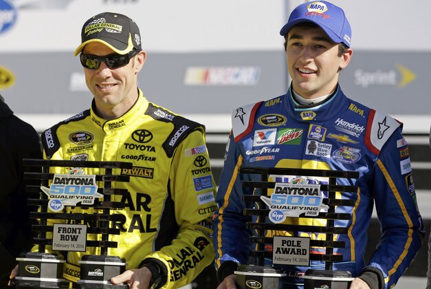 Matt Kenseth, left, and Chase Elliott hold their trophies after they qualified for the top two starting positions in the NASCAR Daytona 500 auto race at Daytona International Speedway, Sunday, Feb. 14, 2016, in Daytona Beach, Fla. (AP Photo/John Raoux)