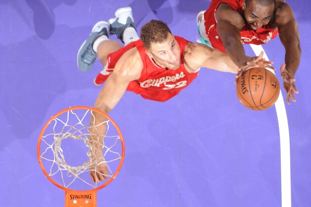LOS ANGELES, CA - DECEMBER 25: Luc Richard Mbah a Moute #12 and Blake Griffin #32 of the Los Angeles Clippers grabs the rebound against the Los Angeles Lakers at STAPLES Center on December 25, 2015 in Los Angeles, California. NOTE TO USER: User expressly acknowledges and agrees that, by downloading and/or using this Photograph, user is consenting to the terms and conditions of the Getty Images License Agreement. Mandatory Copyright Notice: Copyright 2015 NBAE (Photo by Andrew D. Bernstein/NBAE via Getty Images)