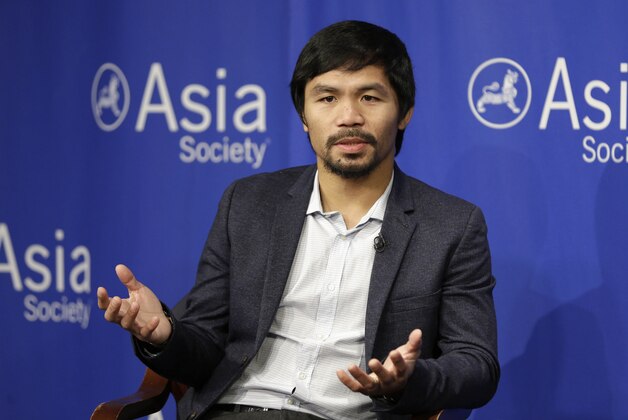 FILE - In this Oct. 12, 2015, file photo, Manny Pacquiao takes questions at the Asia Society in New York. Boxing star Pacquiao has created a firestorm in his home country after saying people in same-sex relationships “are worse than animals.” Pacquiao, who is running for a Philippine Senate seat, made the remark in a video posted Monday, Feb. 15, 2016, on local TV5’s election site. He also said animals are better than people in same-sex relationships because they recognize the difference between males and females. (AP Photo/Seth Wenig, File)