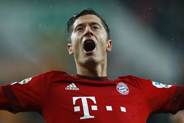 Bayern's Robert Lewandowski celebrates after scoring his side's second goal during the German first division Bundesliga soccer match between FC Augsburg and FC Bayern Munich at the WWK Arena in Augsburg, Germany, Sunday, Feb. 14, 2016. (AP Photo/Matthias Schrader)
