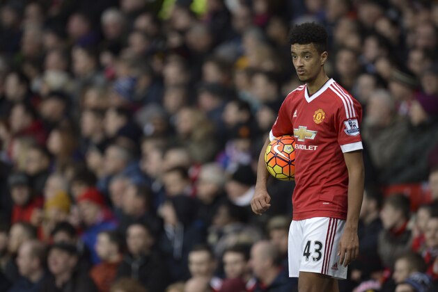 Manchester United's English defender Cameron Borthwick-Jackson prepares to take a throw in during the English Premier League football match between Manchester United and Southampton at Old Trafford in Manchester, north west England, on January 23, 2016. AFP PHOTO / OLI SCARFF

RESTRICTED TO EDITORIAL USE. No use with unauthorized audio, video, data, fixture lists, club/league logos or 'live' services. Online in-match use limited to 75 images, no video emulation. No use in betting, games or single club/league/player publications. / AFP / OLI SCARFF        (Photo credit should read OLI SCARFF/AFP/Getty Images)