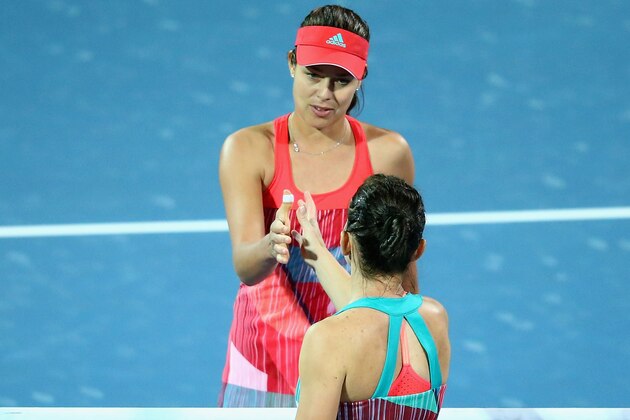 DUBAI, UNITED ARAB EMIRATES - FEBRUARY 17:   Ana Ivanovic of Serbia shakes hands with Simona Halep of Romania after defeating her during their Ladies' Singles third round match during day three of the WTA Dubai Duty Free Tennis Championship at the Dubai Duty Free Stadium  on February 17, 2016 in Dubai, United Arab Emirates.  (Photo by Francois Nel/Getty Images)
