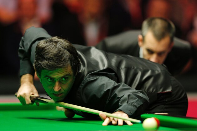 England's Ronnie O'Sullivan plays a shot during the Masters Snooker final against England's Barry Hawkins at Alexandra Palace in north London on January 17, 2016. O'Sullivan overwhelmed Barry Hawkins 10-1 to win the final of the Masters snooker tournament at London's Alexandra Palace on Sunday.  AFP PHOTO / ADRIAN DENNIS / AFP / ADRIAN DENNIS        (Photo credit should read ADRIAN DENNIS/AFP/Getty Images)
