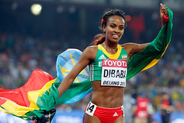Ethiopia's Genzebe Dibaba celebrates after winning a bronze medal in the women’s 5000m final at the World Athletics Championships at the Bird's Nest stadium in Beijing, Sunday, Aug. 30, 2015. (AP Photo/Ng Han Guan)