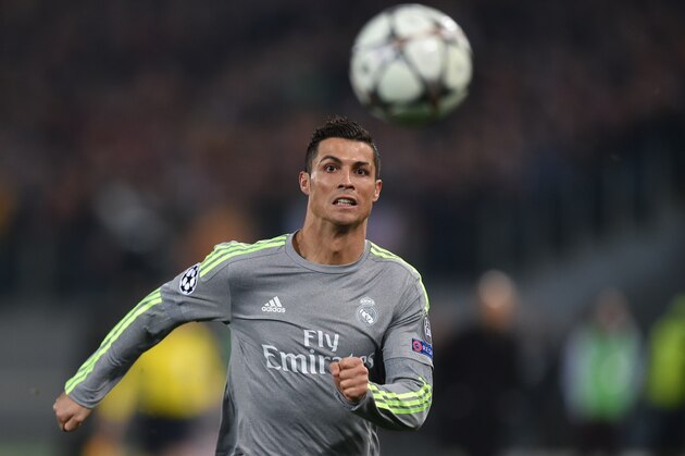 Real Madrid's Portuguese forward Cristiano Ronaldo eyes the ball during the UEFA Champions League football match AS Roma vs Real Madrid on Frebruary 17, 2016 at the Olympic stadium in Rome.   AFP PHOTO / ALBERTO PIZZOLI / AFP / ALBERTO PIZZOLI        (Photo credit should read ALBERTO PIZZOLI/AFP/Getty Images)