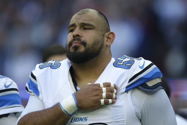 Detroit Lions guard Manny Ramirez (63) pauses during the playing of the anthems before the NFL football game between Detroit Lions and Kansas City Chiefs Wembley Stadium in London,  Sunday, Nov. 1, 2015. (AP Photo/Matt Dunham)