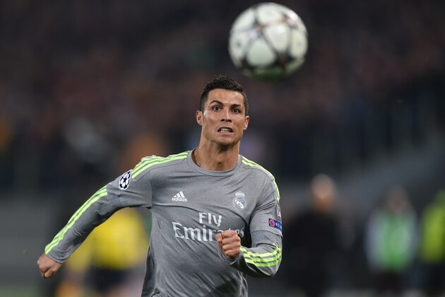 Real Madrid's Portuguese forward Cristiano Ronaldo eyes the ball during the UEFA Champions League football match AS Roma vs Real Madrid on Frebruary 17, 2016 at the Olympic stadium in Rome.   AFP PHOTO / ALBERTO PIZZOLI / AFP / ALBERTO PIZZOLI        (Photo credit should read ALBERTO PIZZOLI/AFP/Getty Images)
