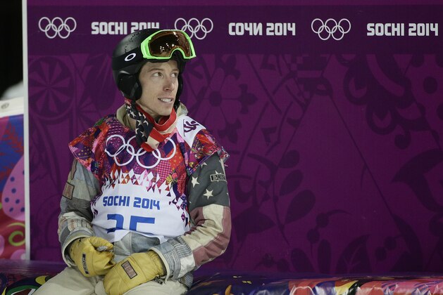 Shaun White, of the United States, looks at the scoreboard after competing in the men's snowboard halfpipe final at the Rosa Khutor Extreme Park, at the 2014 Winter Olympics, Tuesday, Feb. 11, 2014, in Krasnaya Polyana, Russia. White placed fourth. (AP Photo/Jae C. Hong)