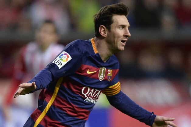 Barcelona's Argentinian forward Lionel Messi celebrates after scoring a goal during the Spanish league football match Real Sporting de Gijon vs FC Barcelona at El Molinon stadium in Gijonon 2016.  AFP PHOTO / MIGUEL RIOPA / AFP / MIGUEL RIOPA        (Photo credit should read MIGUEL RIOPA/AFP/Getty Images)
