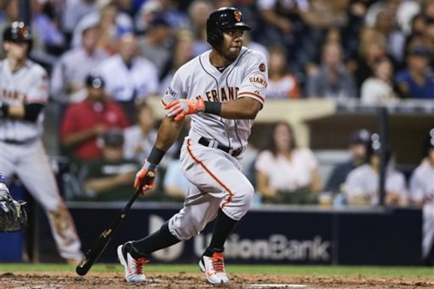 FILE - In this Sept. 24, 2015, file photo, San Francisco Giants' Alejandro De Aza watches his RBI single against the San Diego Padres during the third inning of a baseball game in San Diego. A person familiar with the negotiations says outfielder Alejandro De Aza and the New York Mets have agreed to a contract, pending a physical. The person spoke on condition of anonymity Tuesday, Dec. 22, 2015, because the agreement had not been announced. (AP Photo/Gregory Bull, File)