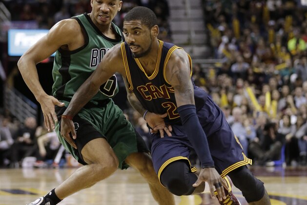 Cleveland Cavaliers' Kyrie Irving (2) drives against Boston Celtics' Avery Bradley (0) in the second half of an NBA basketball game Friday, Feb. 5, 2016, in Cleveland. (AP Photo/Tony Dejak)