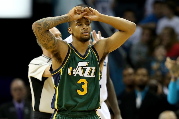 CHARLOTTE, NC - JANUARY 18:  Trey Burke #3 of the Utah Jazz reacts after a play during their game against the Charlotte Hornets at Time Warner Cable Arena on January 18, 2016 in Charlotte, North Carolina.  NOTE TO USER: User expressly acknowledges and agrees that, by downloading and or using this photograph, User is consenting to the terms and conditions of the Getty Images License Agreement.  (Photo by Streeter Lecka/Getty Images)