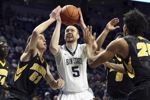 Penn State forward Donovan Jack (5) drives to the basket as Iowa forward Nicholas Baer (51) defends during the first half of an NCAA college basketball game, Wednesday, Feb. 17, 2016, in State College, Pa. (AP Photo/Chris Knight)