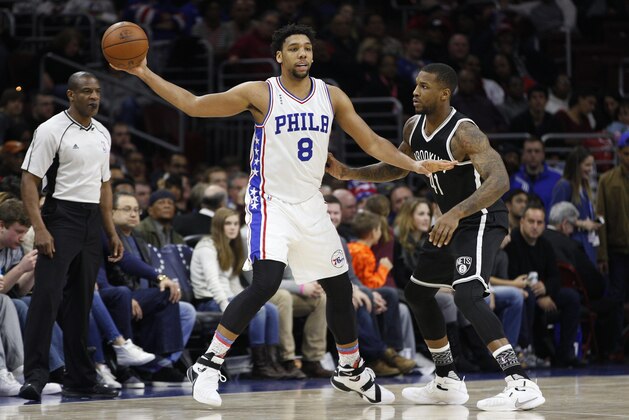 Philadelphia 76ers' Jahlil Okafor (8) in action against Brooklyn Nets' Thomas Robinson (41) during the second half of an NBA basketball game, Saturday, Feb. 6, 2016, in Philadelphia. The 76ers won 103-98. (AP Photo/Chris Szagola)