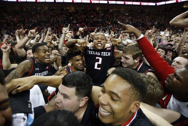 Texas Tech's Devon Thomas sits on top of the crowd after an NCAA college basketball game on Wednesday, Feb. 17, 2016 at  in Lubbock, Texas. Texas Tech beat 65-63. (AP Photo/Brad Tollefson)