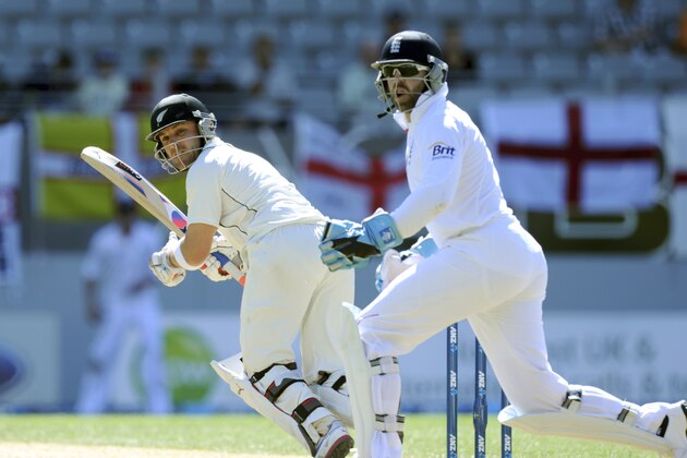 New Zealand's Brendan McCullum, left, turns the ball down leg in front of England's wicket keeper Matt Prior on the fourth day of the 3rd international cricket test, at Eden Park, in Auckland, New Zealand, Monday, March 25, 2013. (AP Photo/SNPA, Ross Setford) NEW ZEALAND OUT