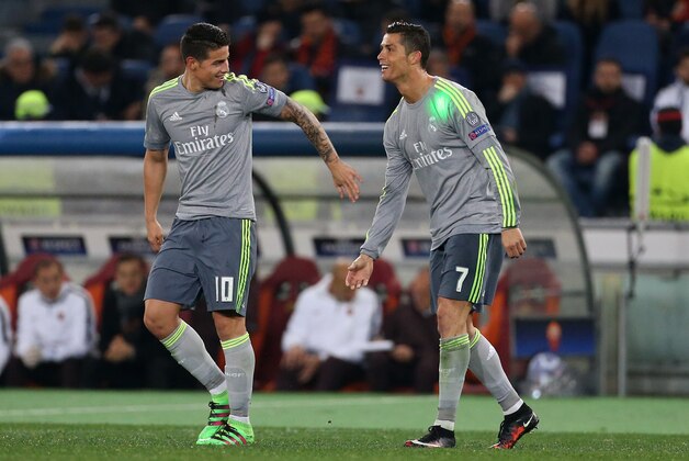ROME, ITALY - FEBRUARY 17: Cristiano Ronaldo of Real Madrid celebrates his goal with James Rodriguez (left) during the UEFA Champions League round of 16 first leg match between AS Roma and Real Madrid CF at Stadio Olimpico on February 16, 2016 in Rome, Italy. (Photo by Jean Catuffe/Getty Images)