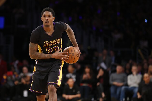 Los Angeles Lakers' Lou Williams controls the ball against the Philadelphia 76ers during the second half of an NBA basketball game, Friday, Jan. 1, 2016, in Los Angeles. The Lakers won 93-84. (AP Photo/Danny Moloshok)