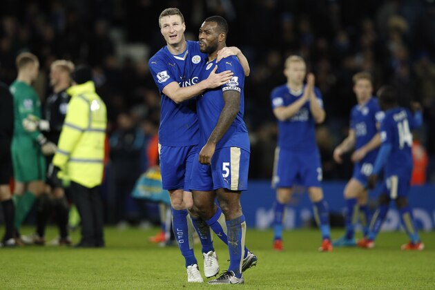 Leicester City's German defender Robert Huth and Leicester City's English defender Wes Morgan (centre right) embrace after the English Premier League football match between Leicester City and Manchester City at King Power Stadium in Leicester, central England on December 29, 2015. The game finished 0-0. AFP PHOTO / ADRIAN DENNIS

RESTRICTED TO EDITORIAL USE. No use with unauthorized audio, video, data, fixture lists, club/league logos or 'live' services. Online in-match use limited to 75 images, no video emulation. No use in betting, games or single club/league/player publications. / AFP / ADRIAN DENNIS        (Photo credit should read ADRIAN DENNIS/AFP/Getty Images)