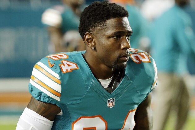 Miami Dolphins cornerback Brice McCain (24) walks off the field before an NFL football game against the New York Giants, Monday, Dec. 14, 2015, in Miami Gardens, Fla.  (AP Photo/Wilfredo Lee)