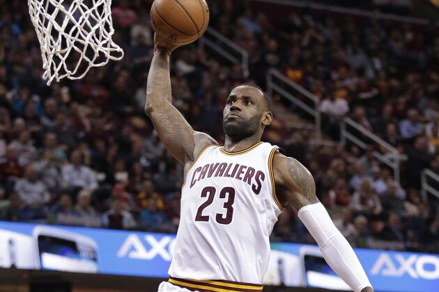 Cleveland Cavaliers' LeBron James dunks the ball against the Sacramento Kings in the first half of an NBA basketball game Monday, Feb. 8, 2016, in Cleveland. (AP Photo/Tony Dejak)