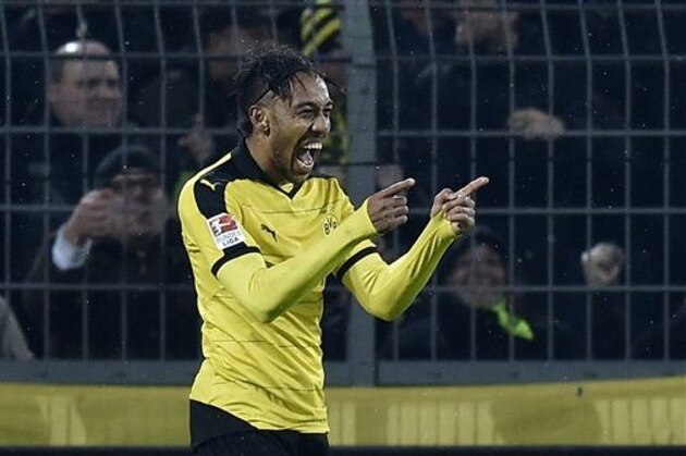 Dortmund's Pierre-Emerick Aubameyang celebrates after scoring his second goal during the German Bundesliga soccer match between Borussia Dortmund and FC Ingolstadt in Dortmund, Germany, Saturday, Jan. 30, 2016. (AP Photo/Martin Meissner)