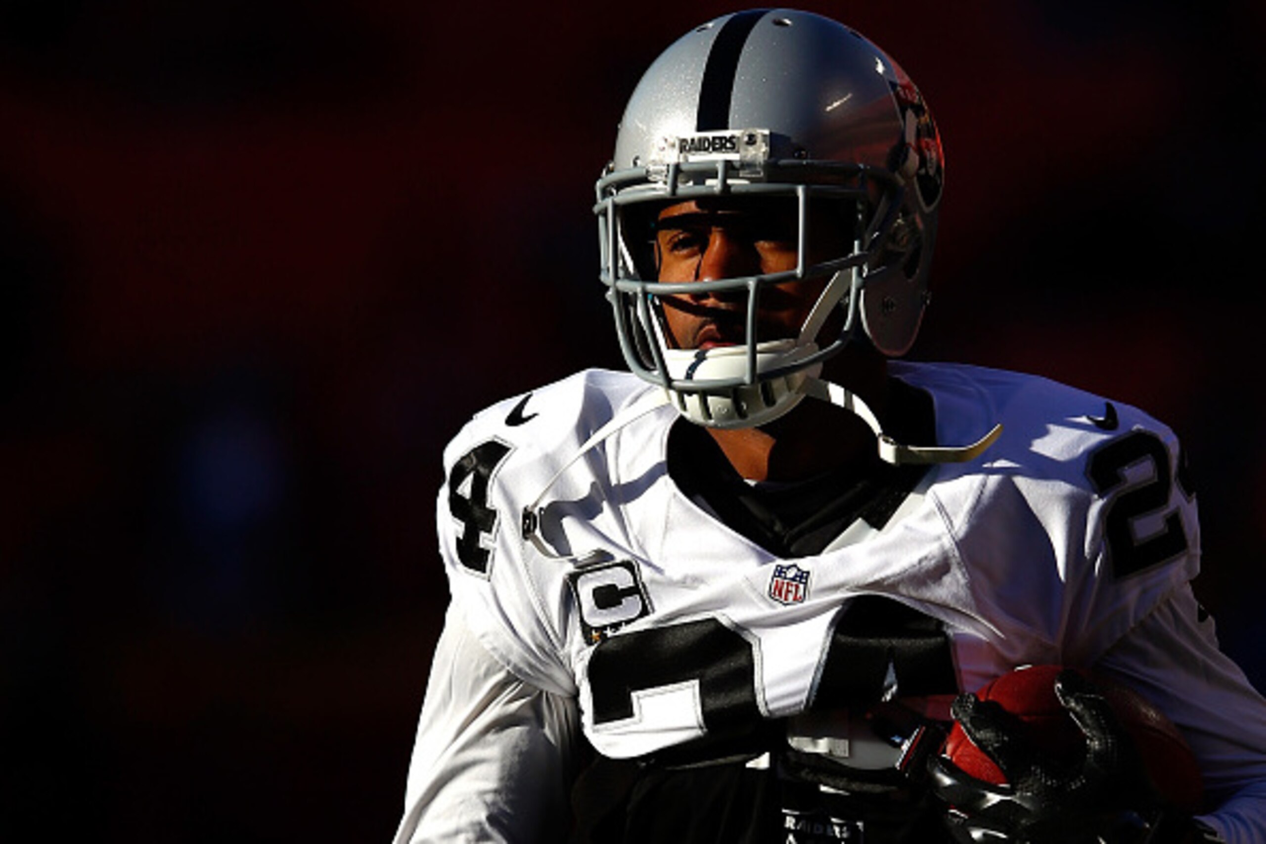 KANSAS CITY, MO - JANUARY 03:  Free safety Charles Woodson #24 of the Oakland Raiders walks onto the field during pre-game warm-ups prior to his final game against the Kansas City Chiefs at Arrowhead Stadium on January 3, 2016 in Kansas City, Missouri.  (Photo by Jamie Squire/Getty Images)