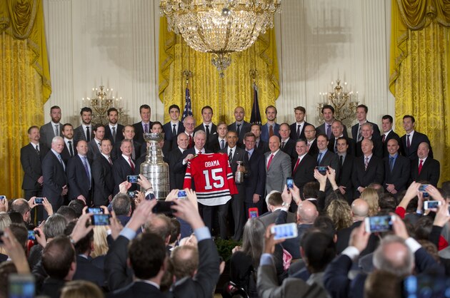 President Barack Obama poses for a group photo during a ceremony to honor the 2015 NHL Stanley Cup Champion Chicago Blackhawks in the East Room of the White House in Washington, Thursday, Feb. 18, 2016. (AP Photo/Pablo Martinez Monsivais)