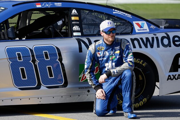 Dale Earnhardt Jr. with his car at qualifying for the NASCAR Daytona 500 auto race at Daytona International Speedway, Sunday, Feb. 14, 2016, in Daytona Beach, Fla. (AP Photo/John Raoux)