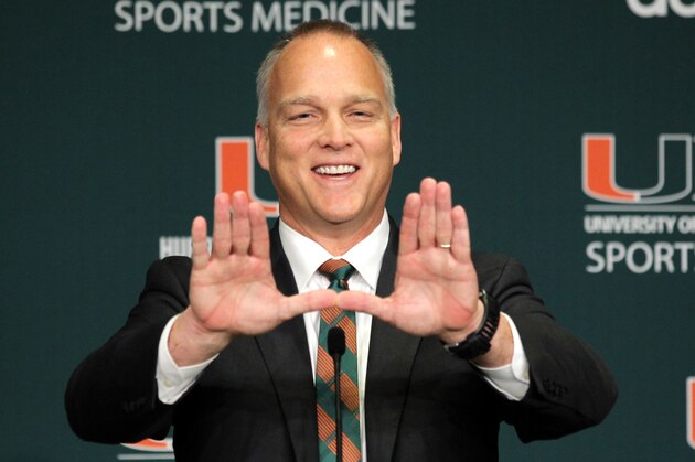 FILE - In this Dec. 4, 2015, file photo, Miami's new football coach Mark Richt gestures after being introduced during an NCAA college football news conference in Coral Gables, Fla. Richt's first signing day as coach of the Miami Hurricanes has finally arrived. His mission: Find players who would love Miami has much as he has for the last 35 years. (AP Photo/Luis M. Alvarez, File)