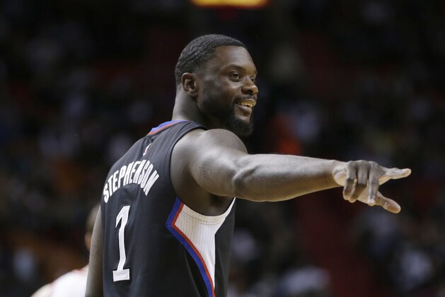 Los Angeles Clippers guard Chris Paul acknowledges a fan during the first half of an NBA basketball game against the Miami Heat, Sunday, Feb. 7, 2016, in Miami. (AP Photo/Lynne Sladky)