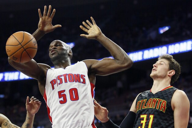 Detroit Pistons’ Joel Anthony (50) dunks against Atlanta Hawks' Mike Muscala (31) during the second half of a preseason NBA basketball game Friday, Oct. 23, 2015, in Auburn Hills, Mich. The Pistons defeated the Hawks 115-87. (AP Photo/Duane Burleson)