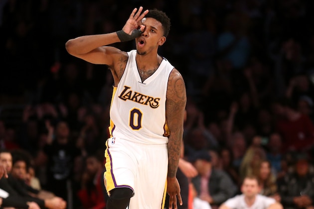 LOS ANGELES, CA - NOVEMBER 30:  Nick Young #0 of the Los Angeles Lakers celebrates after making a three point shot late in the fourth quarter against the Toronto Raptors at Staples Center on November 30, 2014 in Los Angeles, California. The Lakers 129-122 in overtime. NOTE TO USER: User expressly acknowledges and agrees that, by downloading and or using this photograph, User is consenting to the terms and conditions of the Getty Images License Agreement.  (Photo by Stephen Dunn/Getty Images)