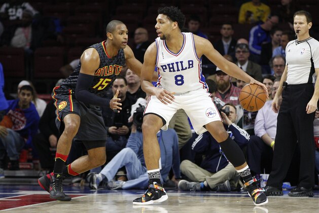 Philadelphia 76ers' Jahlil Okafor (8) in action against Atlanta Hawks' Al Horford (15) during the first half of an NBA basketball game, Wednesday, Feb. 3, 2016, in Philadelphia. The Hawks won 124-86. (AP Photo/Chris Szagola)