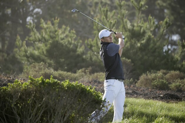 Jordan Spieth follows his shot from the third tee of the Spyglass Hill Golf Course during the first round of the AT&T Pebble Beach National Pro-Am golf tournament Thursday, Feb. 11, 2016, in Pebble Beach, Calif. (AP Photo/Eric Risberg)