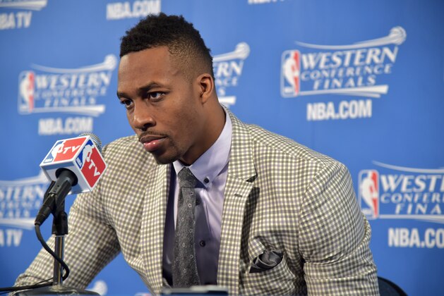 OAKLAND, CA - MAY 27:  Dwight Howard #12 of the Houston Rockets speaks to the media after Game Five of the Western Conference Finals against the Golden State Warriors during the 2015 NBA Playoffs on May 27, 2015 at ORACLE Arena in Oakland, California. NOTE TO USER: User expressly acknowledges and agrees that, by downloading and or using this Photograph, user is consenting to the terms and conditions of the Getty Images License Agreement. Mandatory Copyright Notice: Copyright 2015 NBAE (Photo by Andrew D. Bernstein/NBAE via Getty Images)