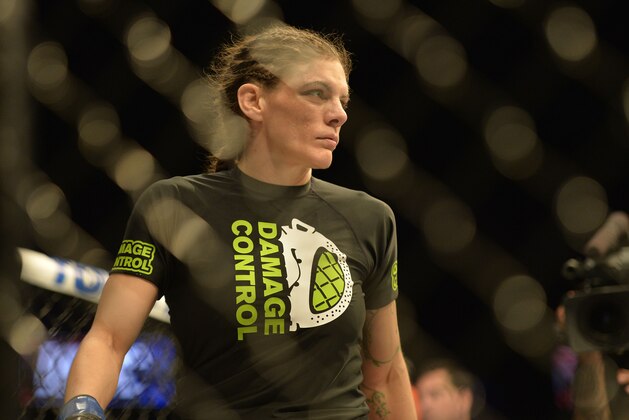 Apr 4, 2015; Fairfax, VA, USA; Lauren Murphy (blue gloves) looks on prior to the fight against Liz Carmouche (not pictured) during UFC Fight Night at Patriot Center. Mandatory Credit: Tommy Gilligan-USA TODAY Sports