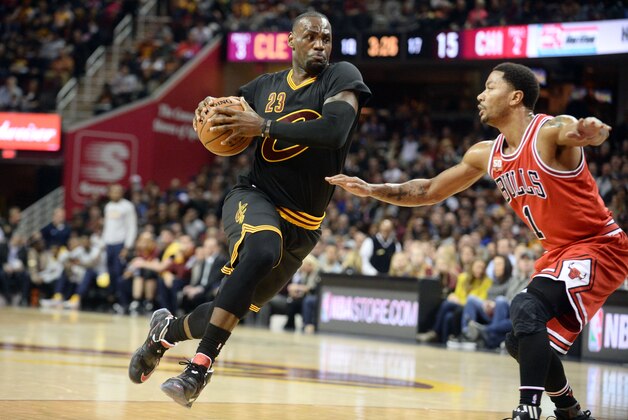 Feb 18, 2016; Cleveland, OH, USA; Cleveland Cavaliers forward LeBron James (23) drives against Chicago Bulls guard Derrick Rose (1) during the first quarter at Quicken Loans Arena. Mandatory Credit: Ken Blaze-USA TODAY Sports