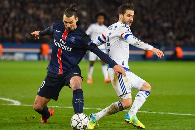 PARIS, FRANCE - FEBRUARY 16:  Cesc Fabregas of Chelsea battles with Zlatan Ibrahimovic of Paris Saint-Germain during the UEFA Champions League round of 16 first leg match between Paris Saint-Germain and Chelsea at Parc des Princes on February 16, 2016 in Paris, France.  (Photo by Mike Hewitt/Getty Images)