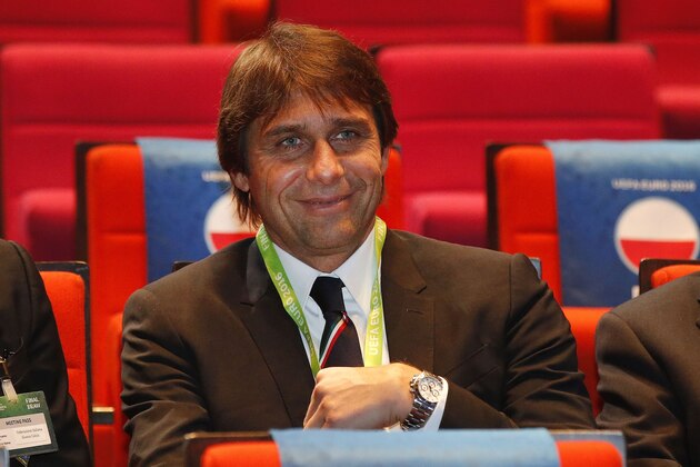 Italy's coach Antonio Conte smiles as he takes his seat for the Euro 2016 soccer championships draw in Paris Saturday, Dec. 12, 2015.  (AP Photo/Michel Euler)