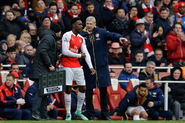 Arsenal's  French manager Arsene Wenger, right, gives instructions to Danny Welbeck during the English Premier League soccer match between Arsenal and Leicester City at the Emirates Stadium in London, Sunday, Feb. 14, 2016.  (AP Photo/Matt Dunham)