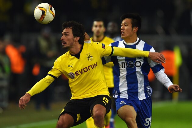 Dortmund's defender Mats Hummels (L) vies with Porto´s South Korean Hyun Jun Suk vie for the ball during the UEFA Europa League Round of 32 football match between Borussia Dortmund and FC Porto in Dortmund, western Germany on February 18, 2016. 

 / AFP / PATRIK STOLLARZ        (Photo credit should read PATRIK STOLLARZ/AFP/Getty Images)