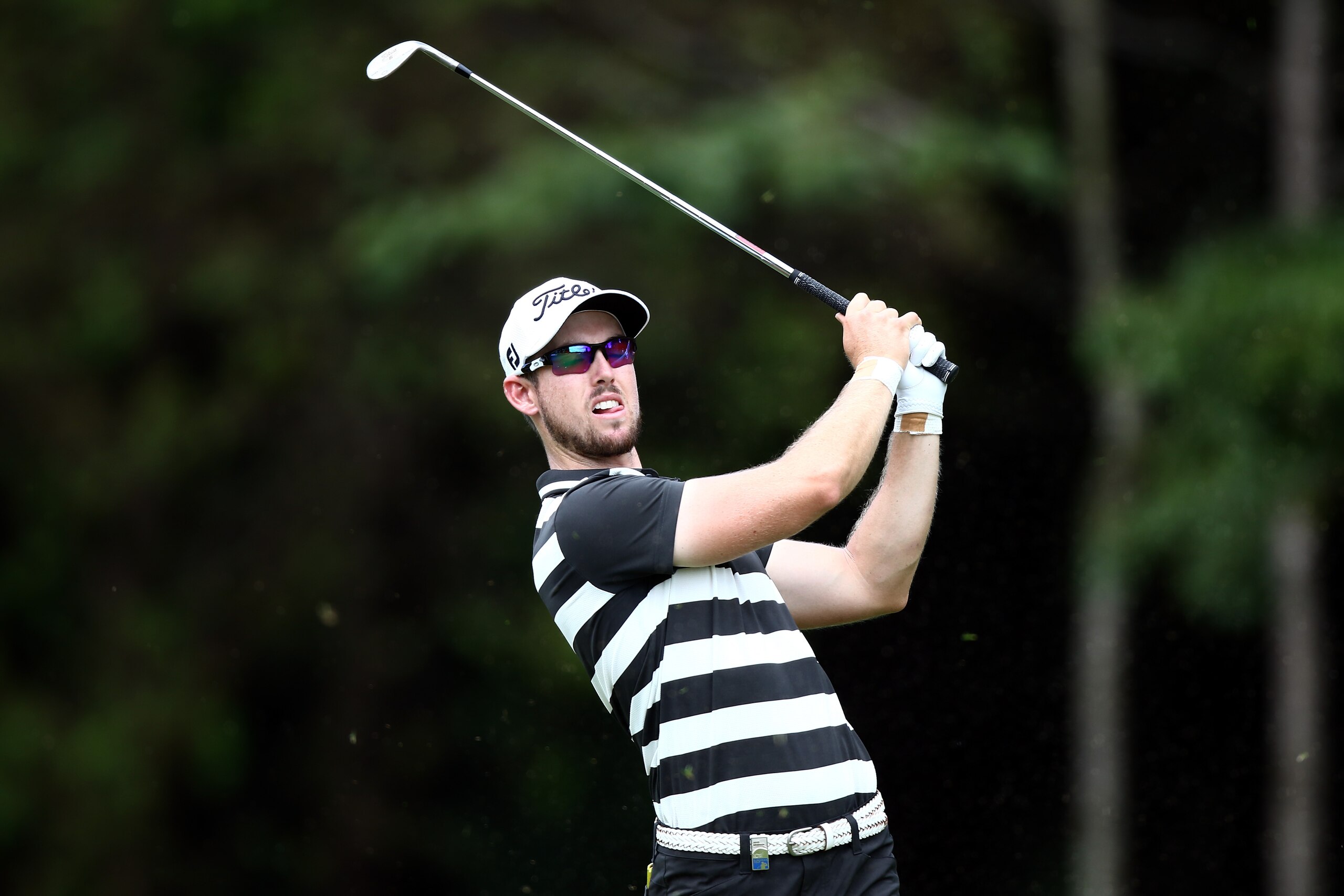 KUALA LUMPUR, MALAYSIA - FEBRUARY 19: Nathan Holman of Australia plays a shot during round two of the Maybank Championship Malaysia at Royal Selangor Golf Club on February 19, 2016 in Kuala Lumpur, Malaysia.  (Photo by Stanley Chou/Getty Images)