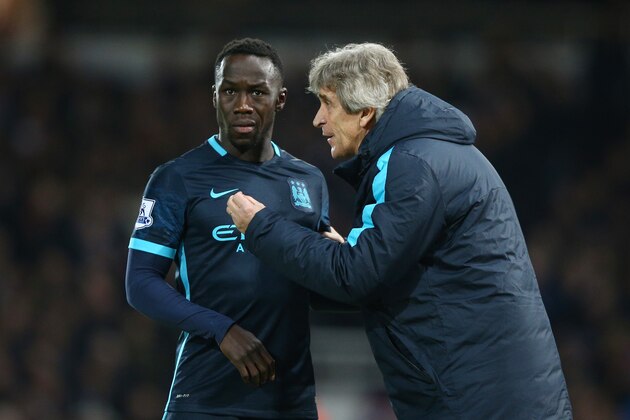 LONDON, ENGLAND - JANUARY 23:  Manuel Pellegrini manager of Manchester City talks to Bacary Sagna of Manchester City during the Barclays Premier League match between West Ham United and Manchester City at the Boleyn Ground on January 23, 2016 in London, England.  (Photo by Paul Gilham/Getty Images)
