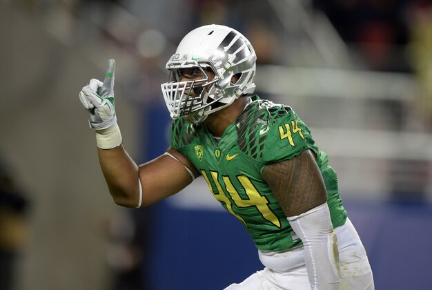 Dec 5, 2014; Santa Clara, CA, USA; Oregon Ducks defensive end DeForest Buckner (44) celebrates after a sack in the second quarter against the Arizona Wildcats in the Pac-12 Championship at Levi's Stadium. Mandatory Credit: Kirby Lee-USA TODAY Sports