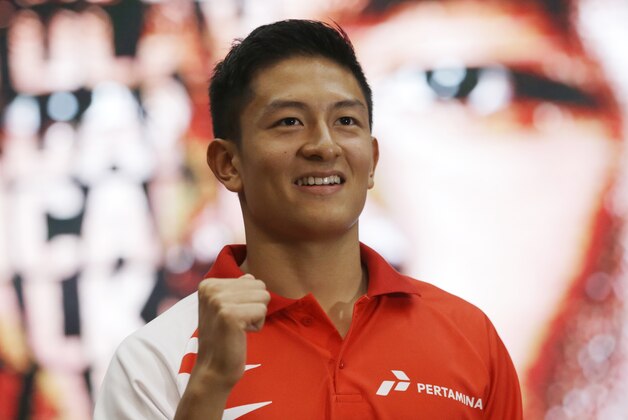 Rio Haryanto, the first Indonesian Formula One driver, poses for photographers during a press conference in Jakarta, Indonesia, Thursday, Feb. 18, 2016. F1 team Manor has appointed Rio Haryanto as one of its race drivers for the coming season. (AP Photo/Achmad Ibrahim)