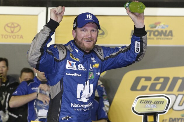 Dale Earnhardt Jr celebrates in Victory Lane after winning the first of two qualifying races for Sunday's NASCAR Daytona 500 Sprint Cup series auto race at Daytona International Speedway in Daytona Beach, Fla., Thursday, Feb. 18, 2016. (AP Photo/Chuck Burton)