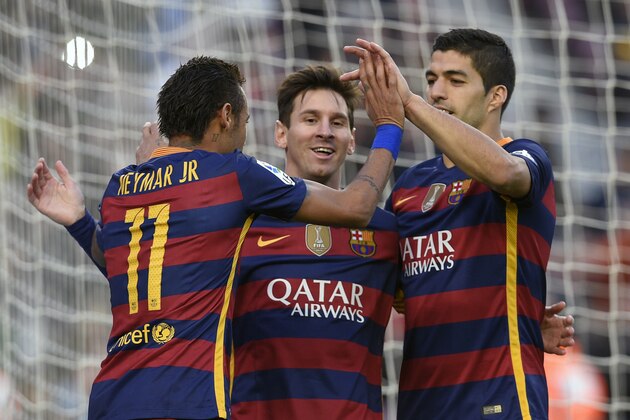 Barcelona's Argentinian forward Lionel Messi (C) celebrates a goal with teammates Barcelona's Brazilian forward Neymar (L) and Barcelona's Uruguayan forward Luis Suarez (R) during the Spanish league football match FC Barcelona vs Granada CF at the Camp Nou stadium in Barcelona on January 9, 2016.   AFP PHOTO / LLUIS GENE / AFP / LLUIS GENE        (Photo credit should read LLUIS GENE/AFP/Getty Images)