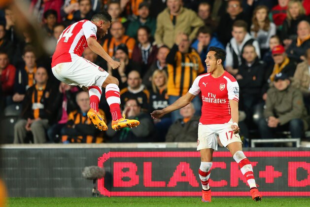 HULL, ENGLAND - MAY 04:  Alexis Sanchez of Arsenal (R) celebrates with Francis Coquelin after scoring their first goal during the Barclays Premier League match between Hull City and Arsenal at the KC Stadium on May 4, 2015 in Hull, England.  (Photo by Alex Livesey/Getty Images)